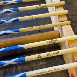 Several customised golf alignment sticks